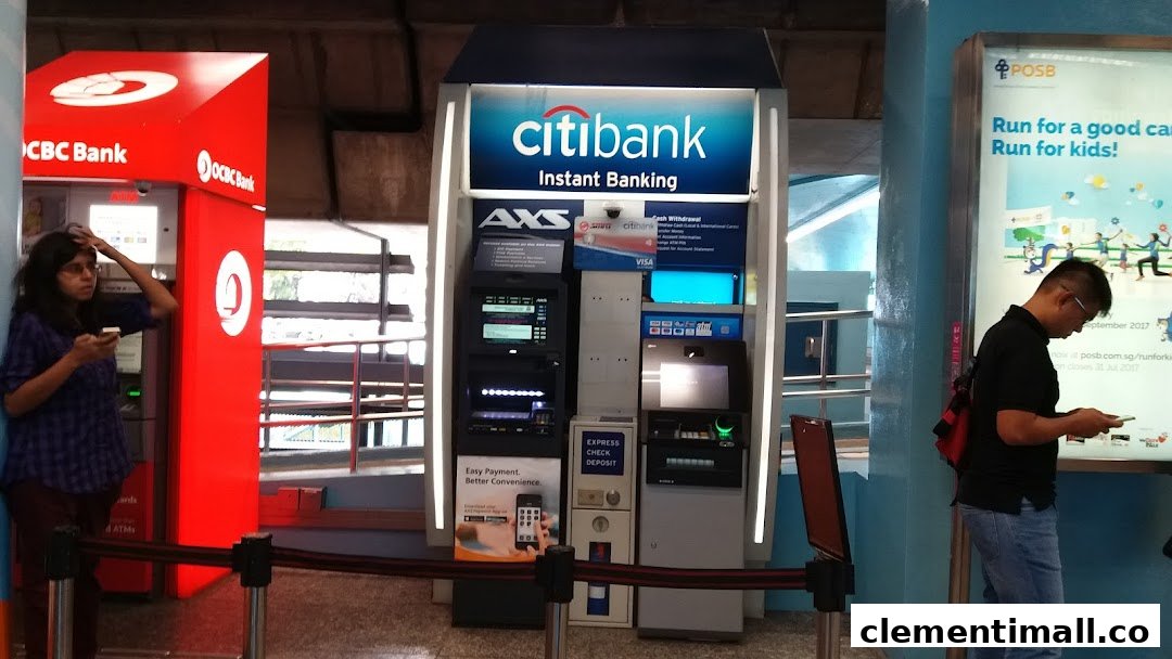 People using Citibank, OCBC Bank, and AXS self-service banking kiosks at a mall.