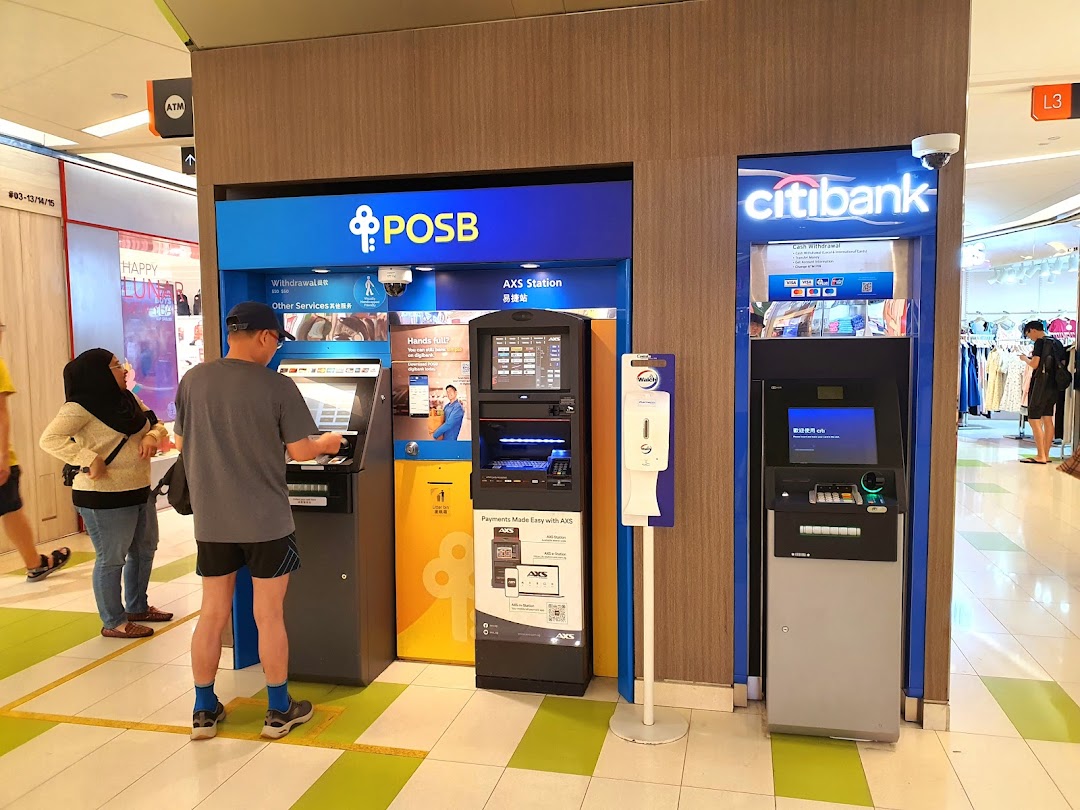People utilize POSB and Citibank ATMs and an AXS payment station within a shopping mall.