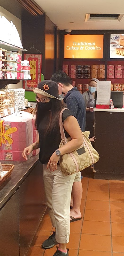 Customers browse traditional cakes and cookies at Bengawan Solo, a shop specializing in Indonesian delicacies.