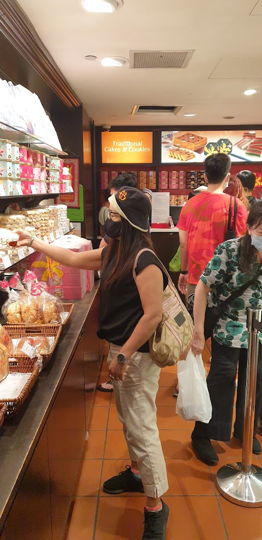 Customers browse shelves filled with traditional cakes and cookies at Bengawan Solo bakery.