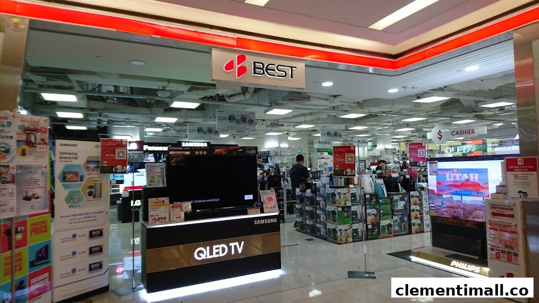 The entrance of Best Denki electronics store, showcasing various TVs and home appliances.
