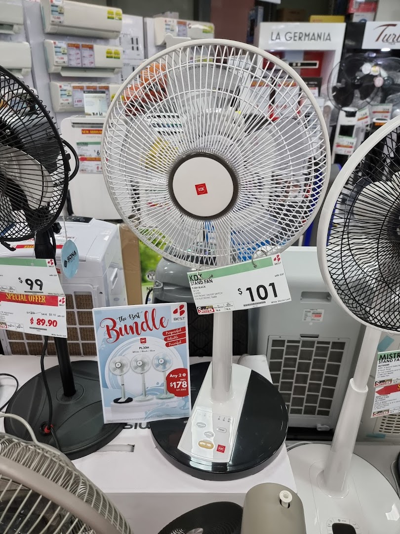A display of various fans and home electronics, including air conditioners, inside an electronics store.