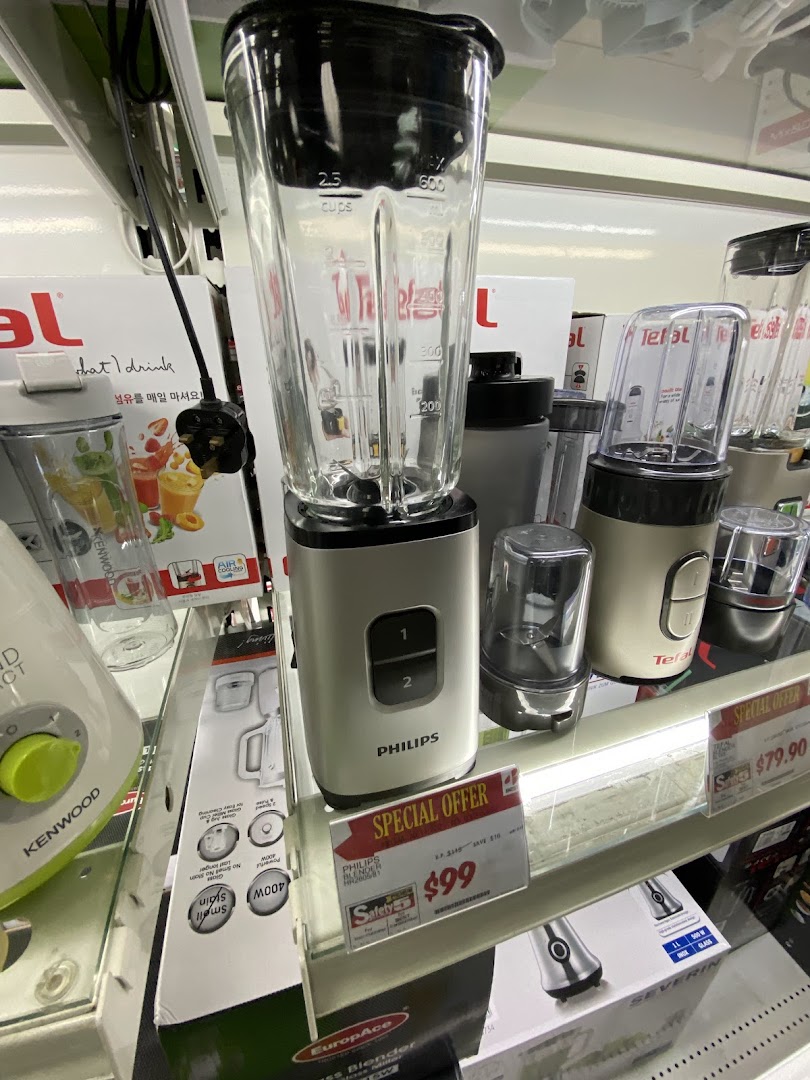 Close-up of blenders and kitchen appliances on display shelves, featuring a Philips blender on special offer.