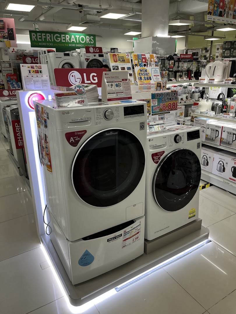 Interior view of Best Denki showcasing LG washing machines and various home appliances on display.