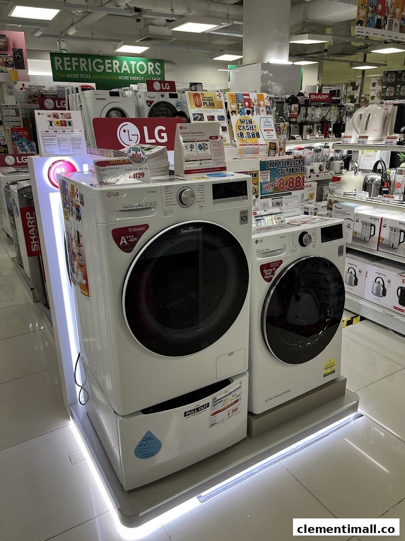 Interior view of Best Denki showcasing LG washing machines and various home appliances on display.