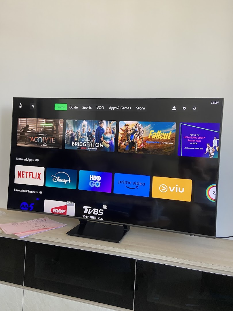 A smart TV screen displaying popular streaming apps like Netflix, Disney+, and Prime Video.
