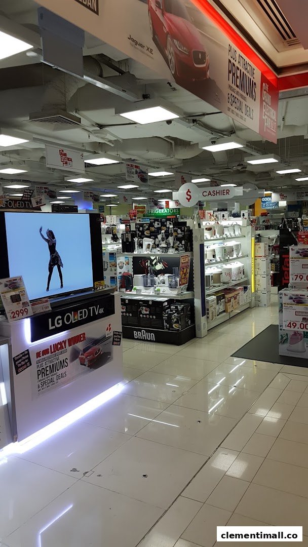 An interior view of Best Denki, showcasing a large LG OLED TV display, various home appliances, and promotional signage.