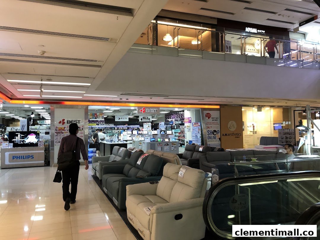 Interior view of Best Denki electronics store entrance within a bustling shopping mall.