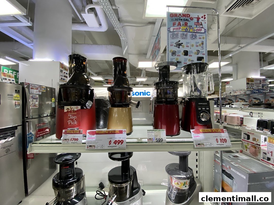 A display of modern kitchen appliances, including juicers and blenders, with promotional offers at Best Denki.