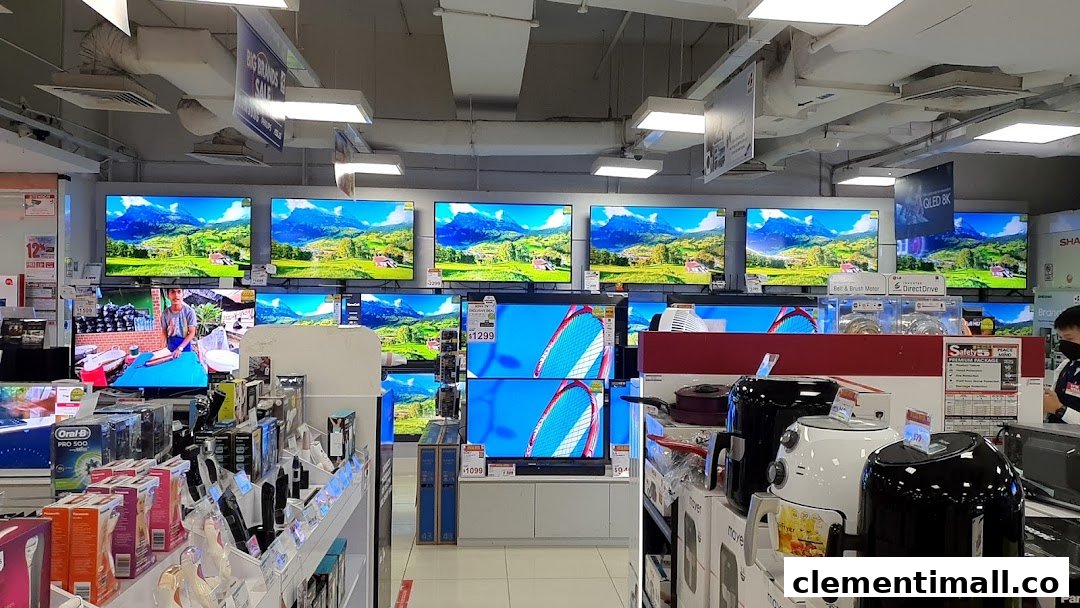 An interior view of Best Denki, showcasing rows of televisions, small appliances, and various electronics.