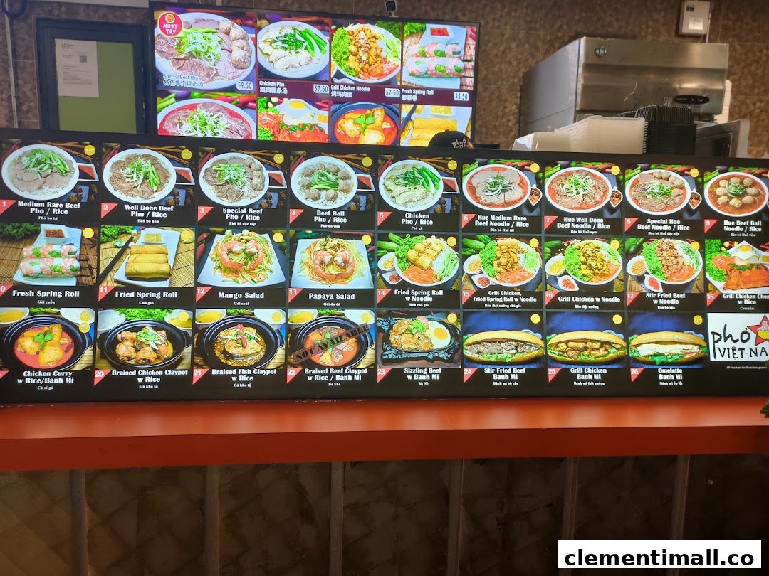 A vibrant digital menu board showcasing a variety of Vietnamese dishes with appealing images and prices.