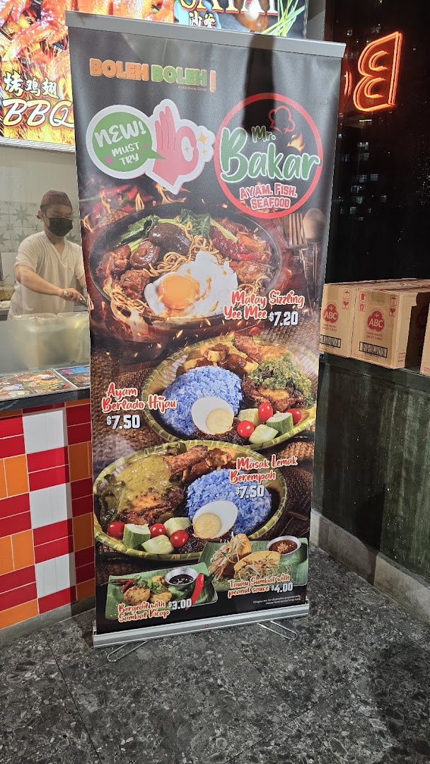 A vibrant banner showcasing various Malay dishes and their prices from Mr. Bakar.