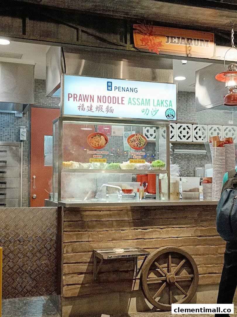 A food stall counter at Boleh Boleh! Clementi Mall, featuring Penang Prawn Noodle and Assam Laksa.