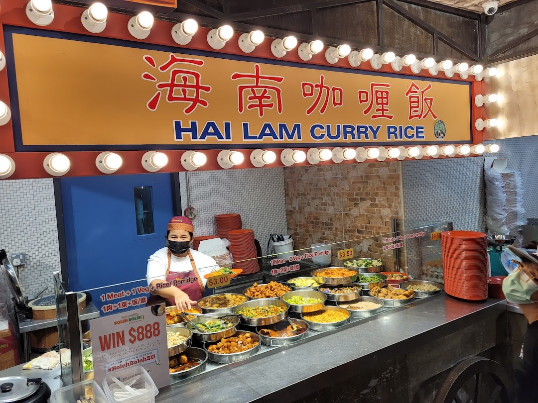 A vibrant food stall at Boleh Boleh! Clementi Mall showcasing a variety of Hai Lam Curry Rice dishes.