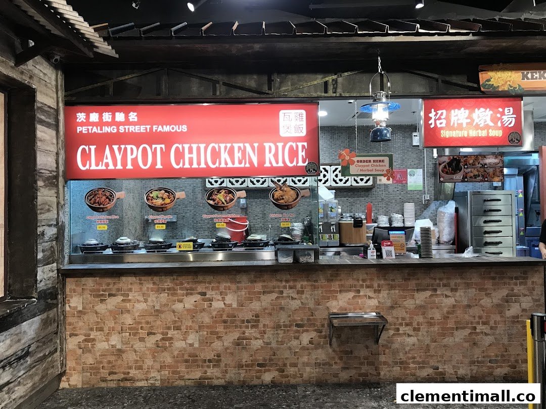A food stall counter at Boleh Boleh! Clementi Mall, featuring Claypot Chicken Rice and Signature Herbal Soup.
