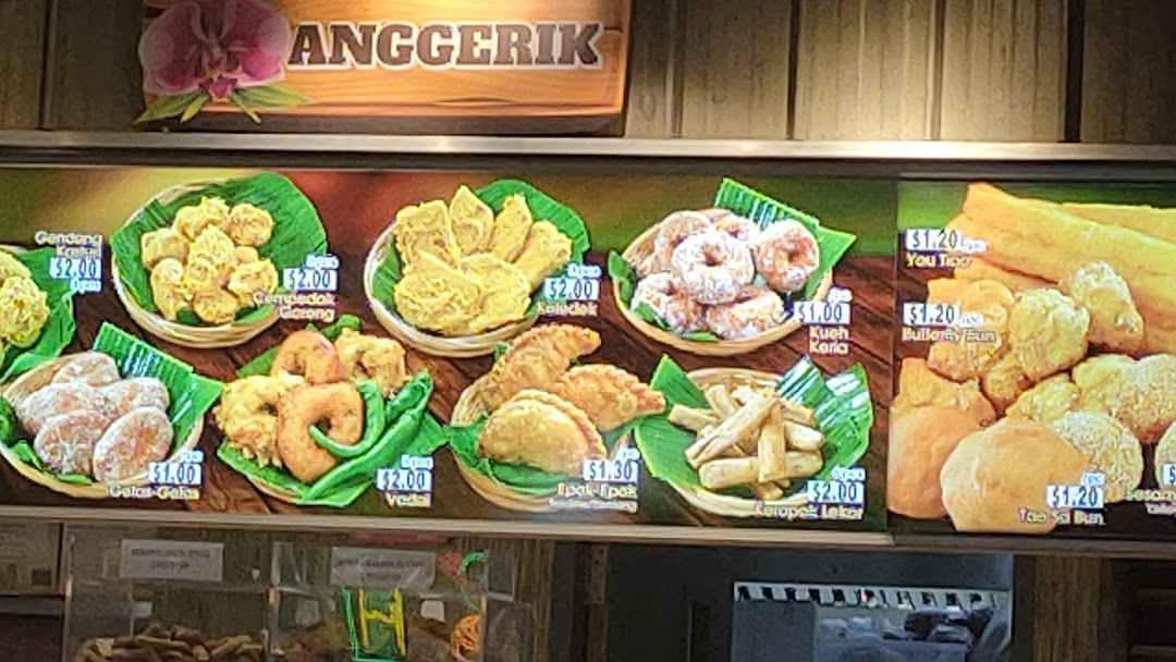A vibrant display board showcasing various traditional fried snacks and pastries with their prices.