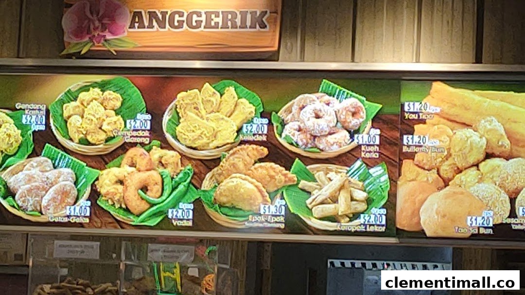 A vibrant display board showcasing various traditional fried snacks and pastries with their prices.