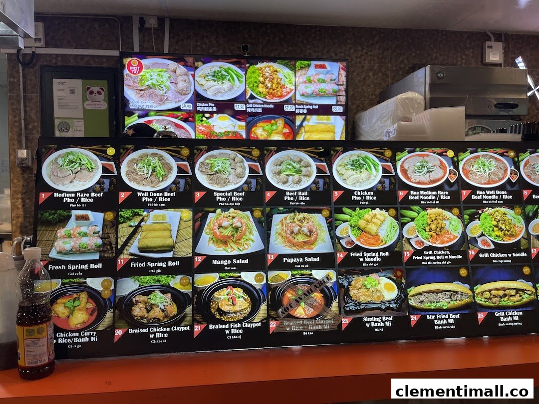 A digital menu board displaying various Vietnamese dishes with images and prices.