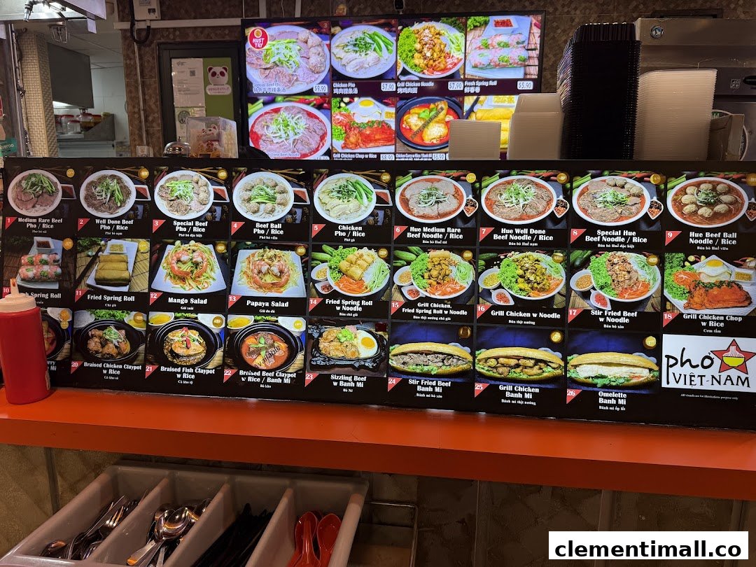 A vibrant menu board displaying a variety of Vietnamese dishes, including pho, noodles, rice, and banh mi.