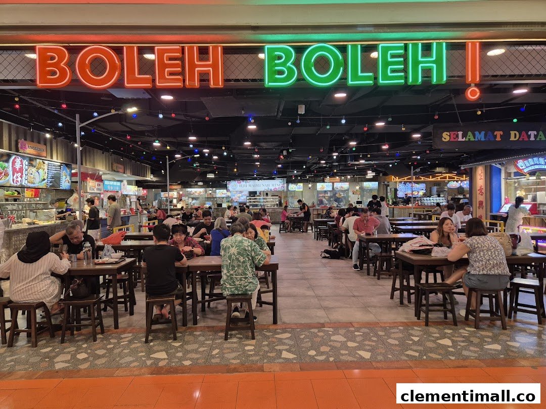 A vibrant food court, Boleh Boleh!, filled with diners enjoying various local dishes.