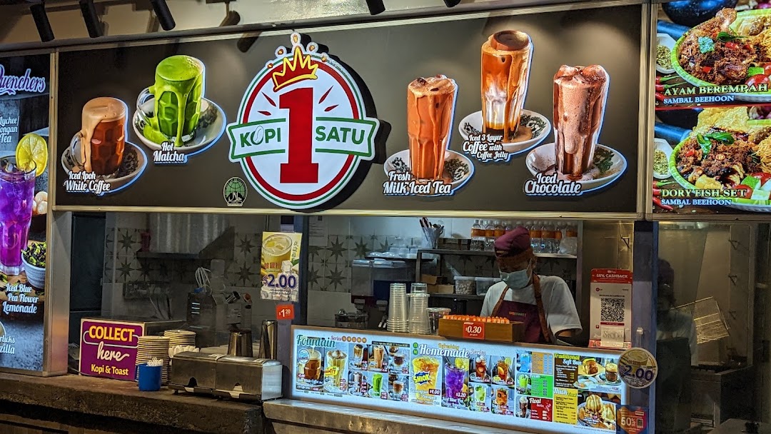 A vibrant menu display showcasing various beverages and food items at a shop counter.