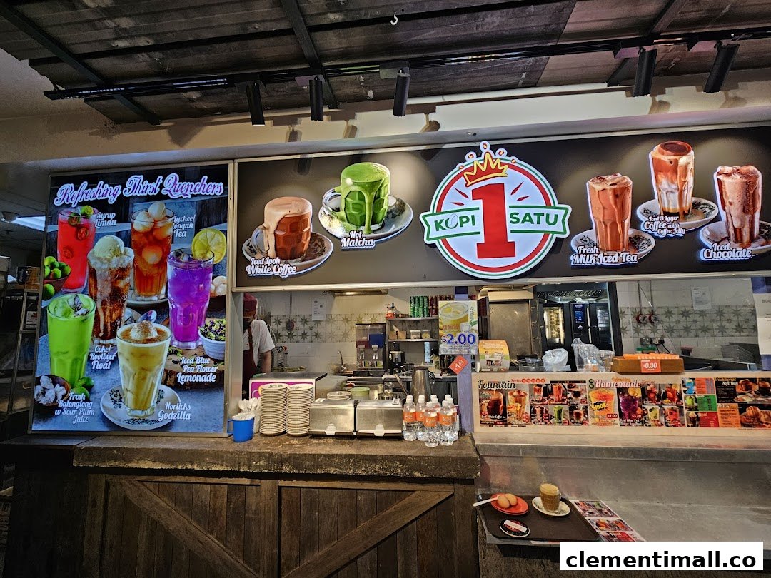 A vibrant display of various refreshing drinks and coffee specialties at a food stall counter.