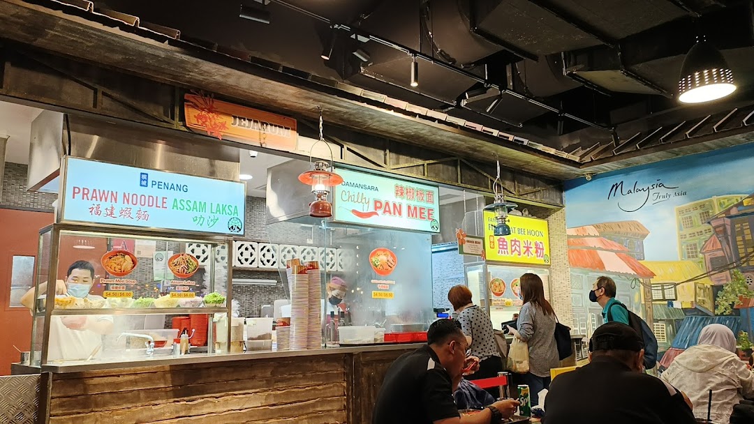 A bustling food stall at Boleh Boleh! Clementi Mall, serving Malaysian hawker delights like Prawn Noodle and Pan Mee.