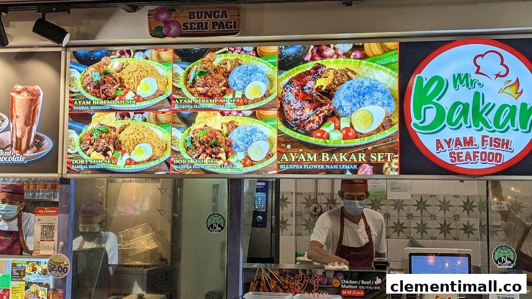A food stall counter with digital menu displays showcasing grilled dishes and staff.