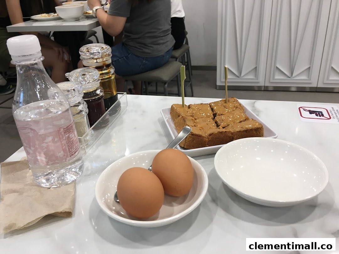 A table set with toast, eggs, water, and condiments, showing a casual dining experience.