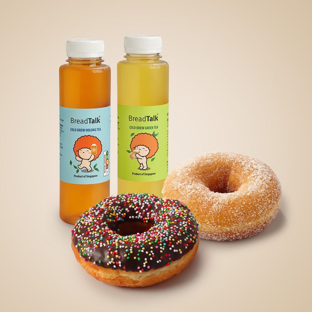 Two BreadTalk cold brew teas and two delicious donuts, one chocolate sprinkle and one sugar-coated.