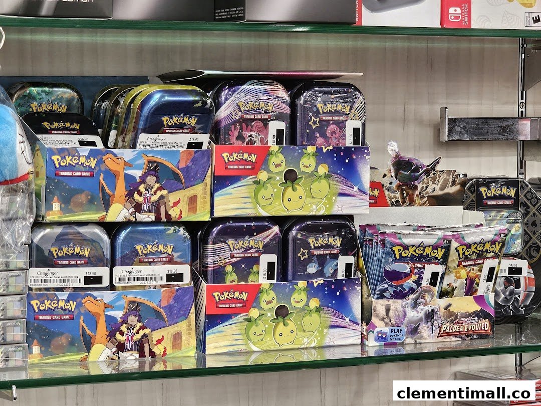 A display shelf filled with various Pokémon Trading Card Game products, including tins and booster packs.