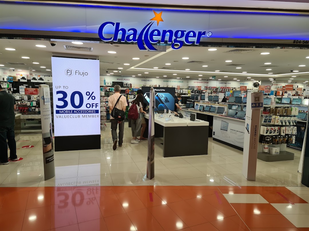 The entrance of Challenger electronics store, showcasing product displays and a mobile accessories promotion.