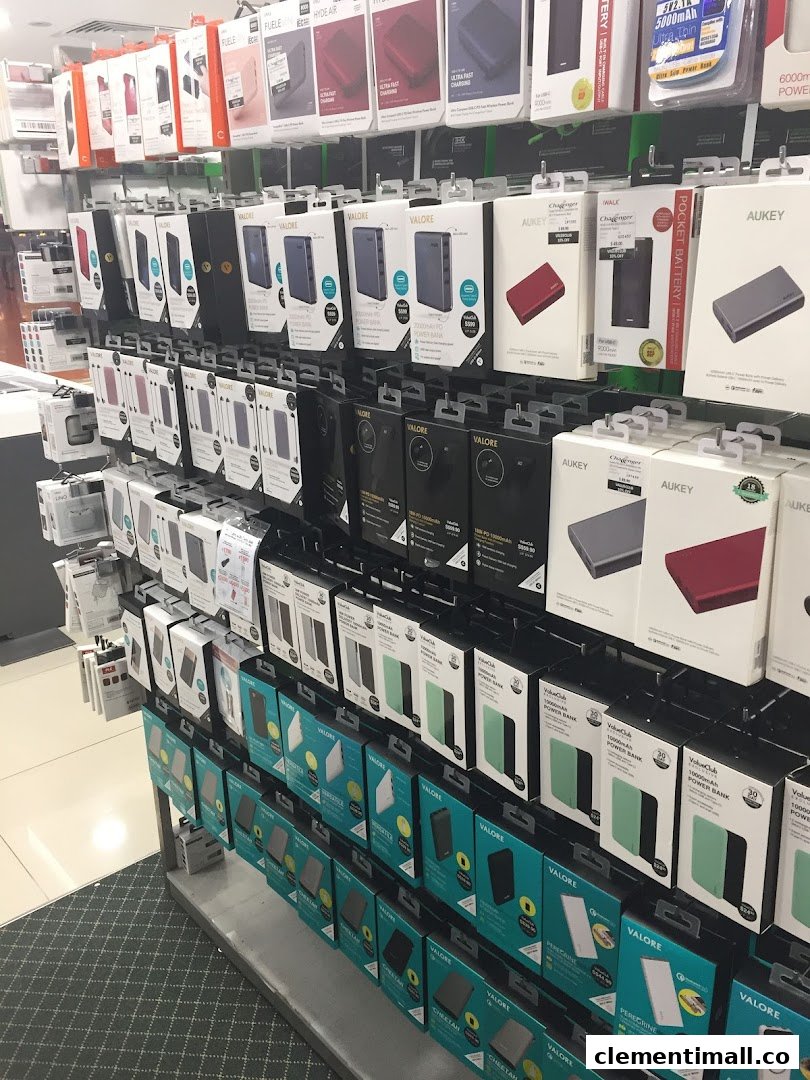 A retail display wall showcasing a wide range of power banks and mobile accessories.