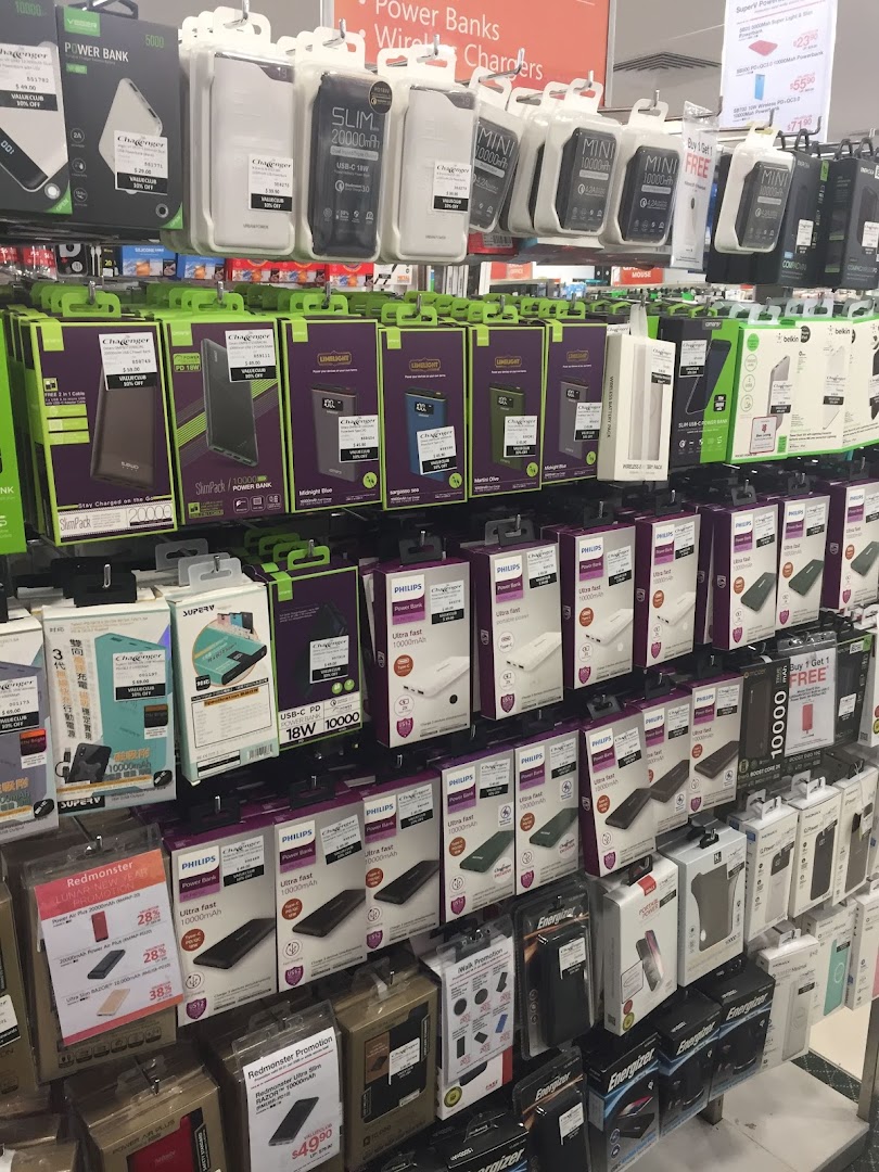 A retail display showcasing various power banks and wireless chargers.