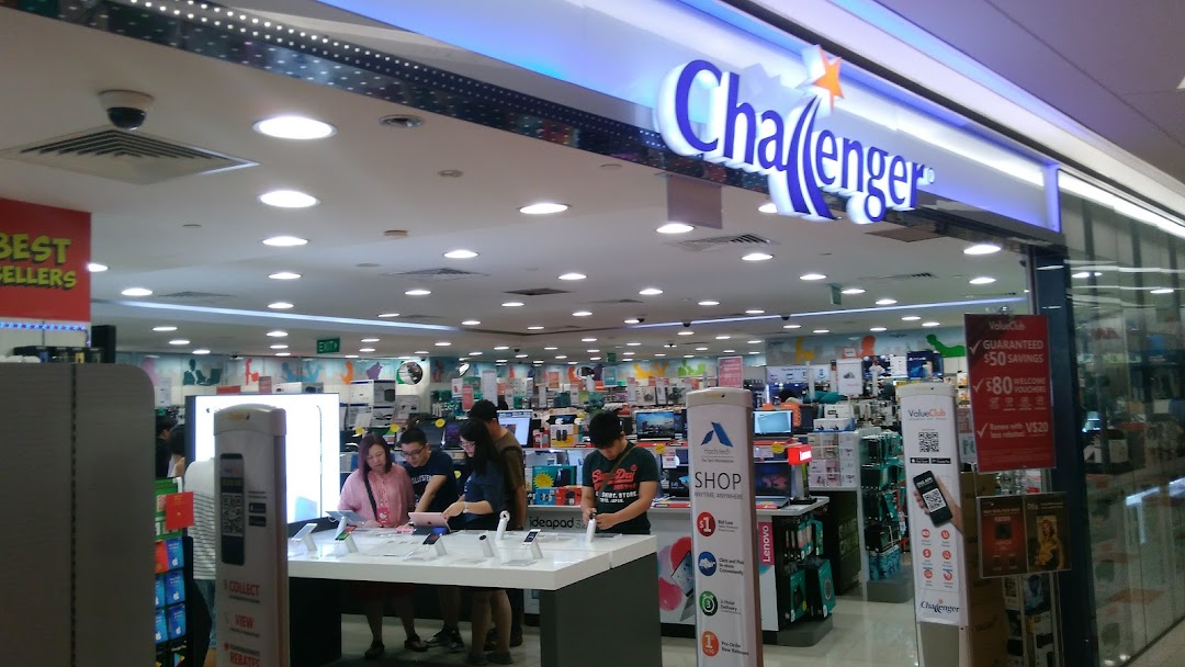 The brightly lit entrance of Challenger electronics store, showcasing a wide array of tech products and customers browsing.