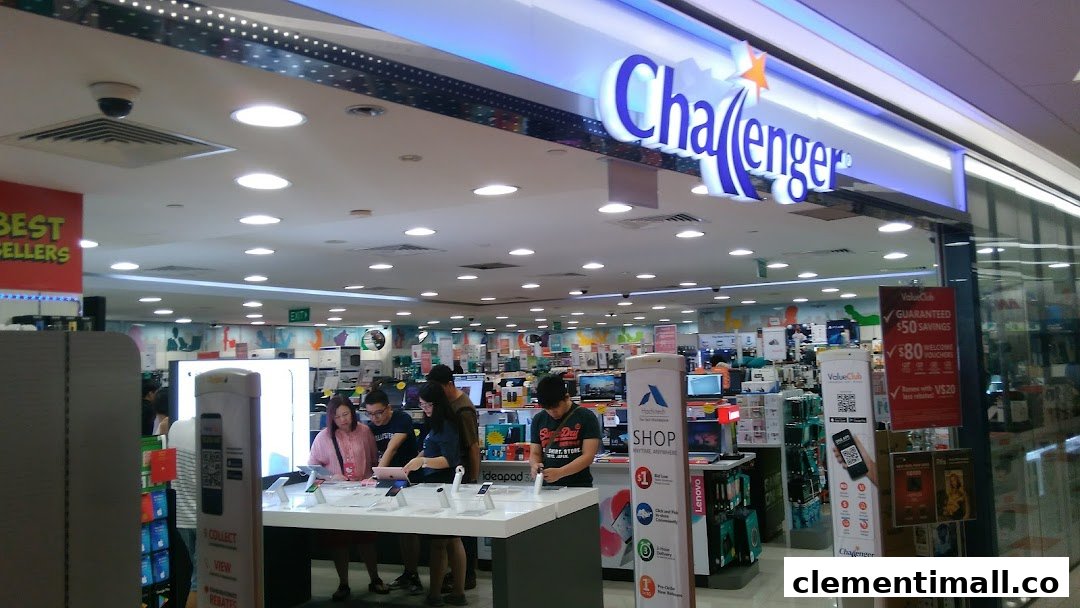 The brightly lit entrance of Challenger electronics store, showcasing a wide array of tech products and customers browsing.