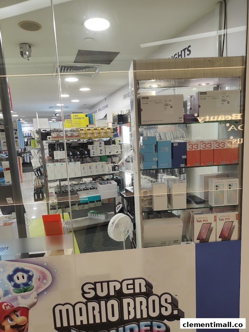 View into Challenger electronics store, showcasing mobile gadgets and accessories through its glass facade.