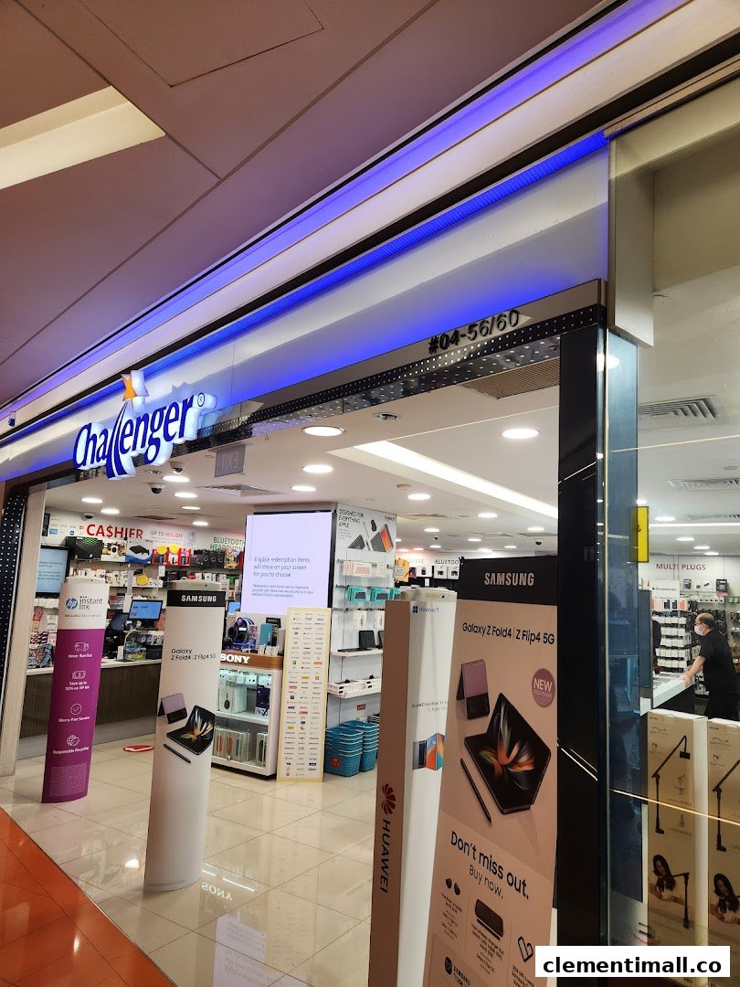 The brightly lit entrance of Challenger electronics store showcasing various tech product displays.