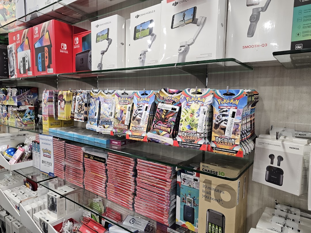 Shelves filled with Nintendo Switch consoles, DJI gimbals, Pokémon cards, and various electronics accessories.