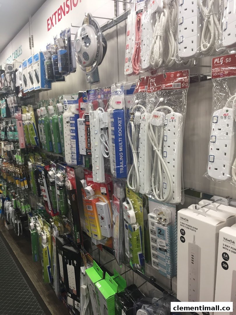 A retail display showcasing a wide range of power strips, extension cords, and electronic cables.