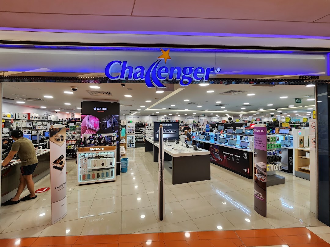 Brightly lit entrance of Challenger electronics store showcasing various tech products and displays.
