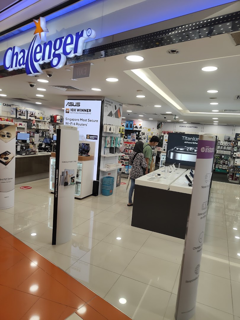 The entrance of Challenger electronics store, showcasing a wide range of tech products and accessories.