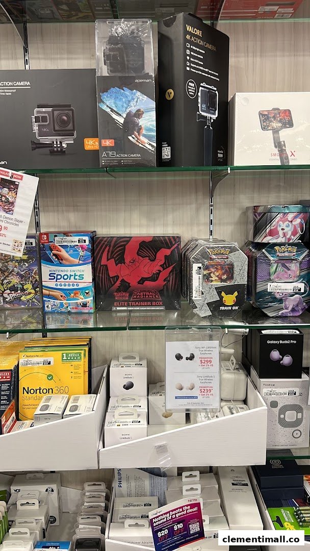 Shelves filled with electronics, gaming products, and accessories like action cameras, headphones, and software.