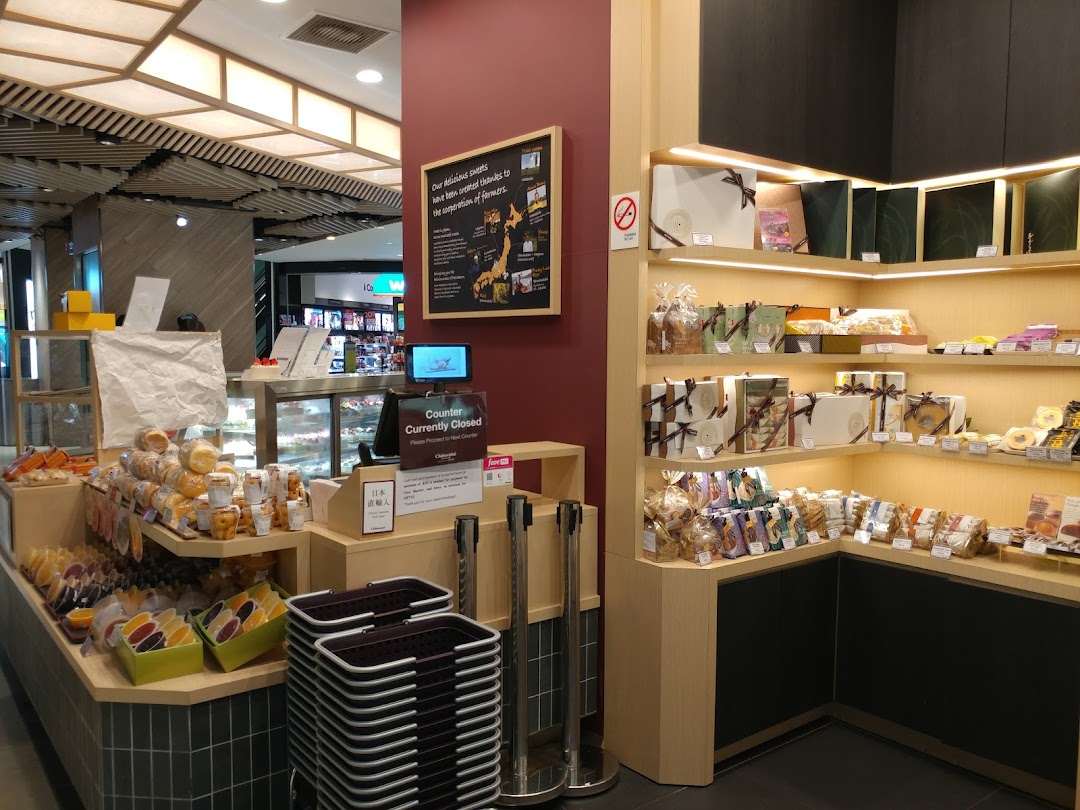 Interior view of Châteraisé, a Japanese confectionery shop, showcasing a variety of sweets, gifts, and a counter.