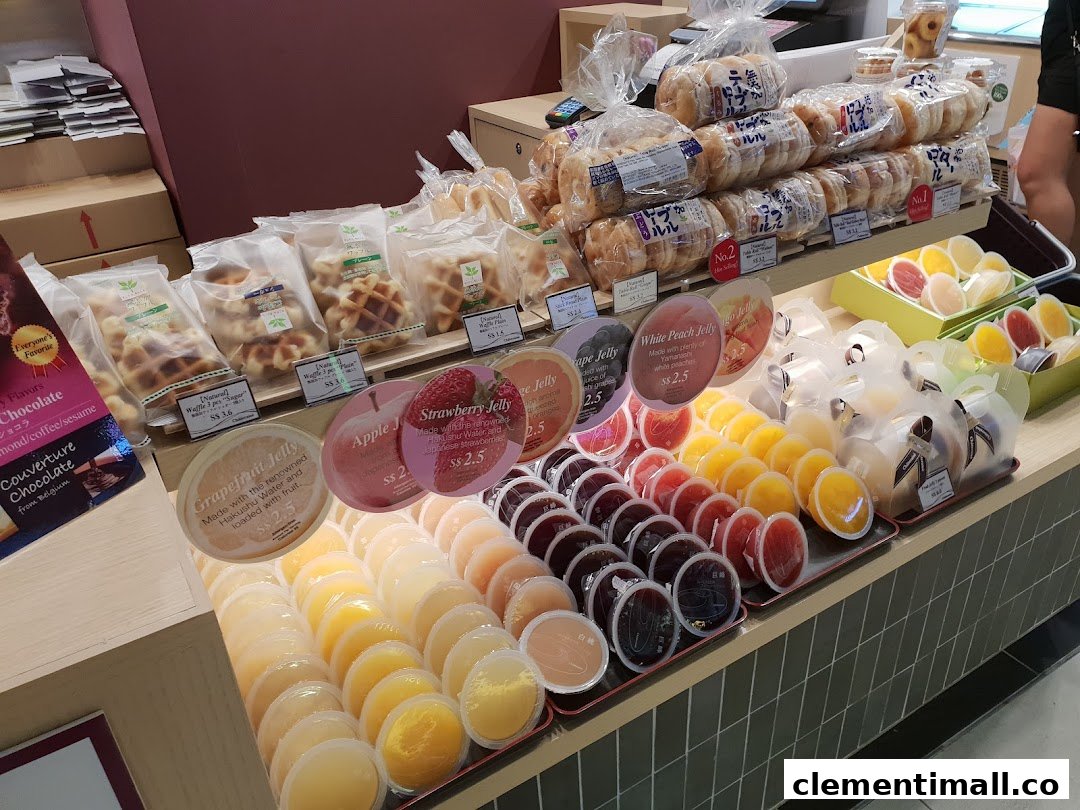 A vibrant display of Châteraisé's fresh fruit jellies, waffles, and baked goods in-store.