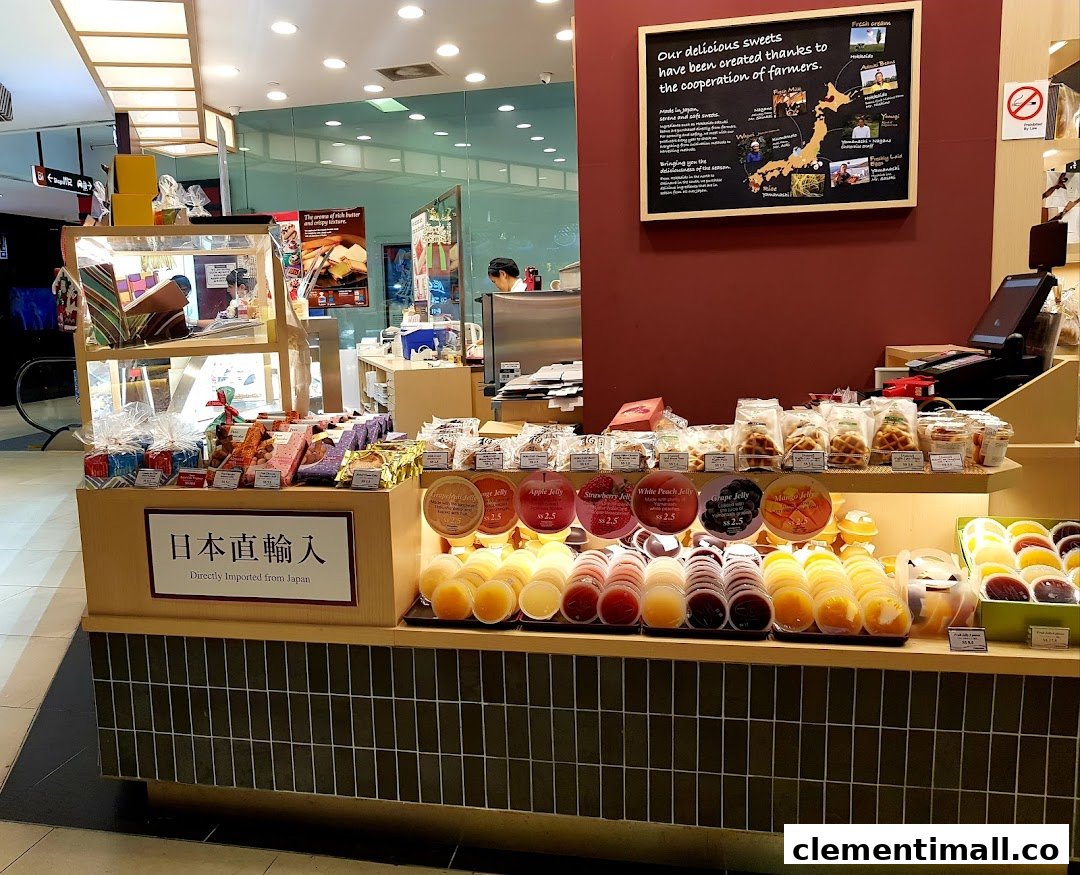 A vibrant display counter at Châteraisé showcasing an array of fresh Japanese jellies, sweets, and baked goods.