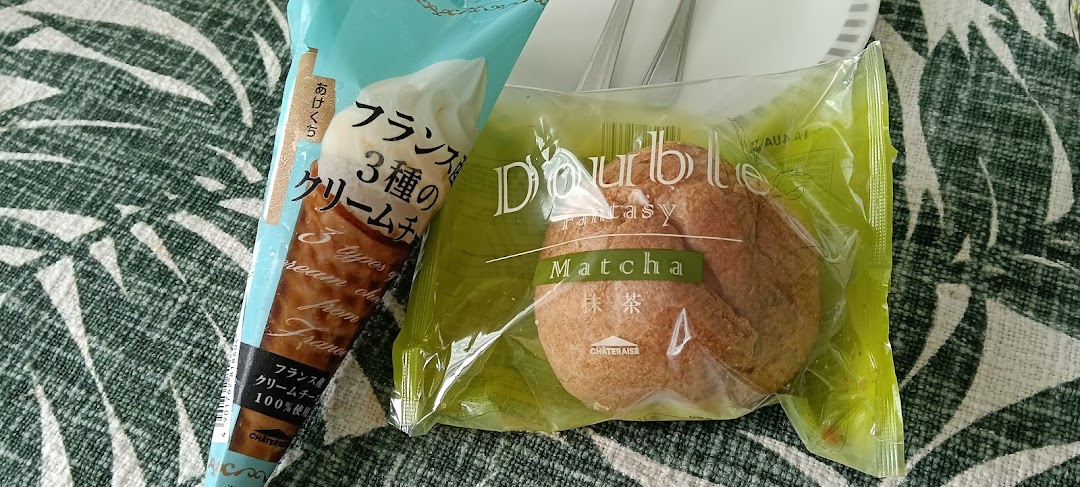 Two packaged Châteraisé desserts, including a matcha cream puff and a French cream cheese ice cream.