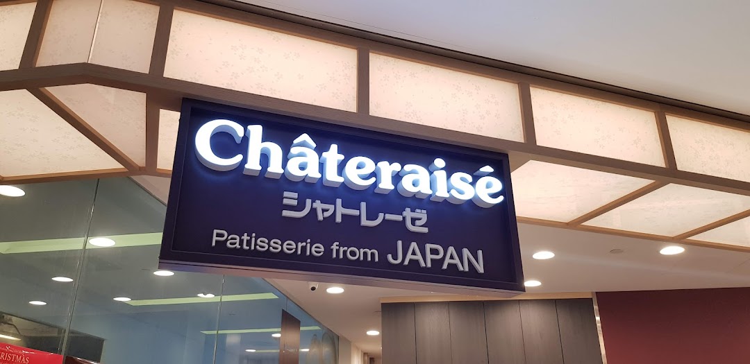 The illuminated Châteraisé shop sign, featuring its name and 'Patisserie from JAPAN', above the entrance.