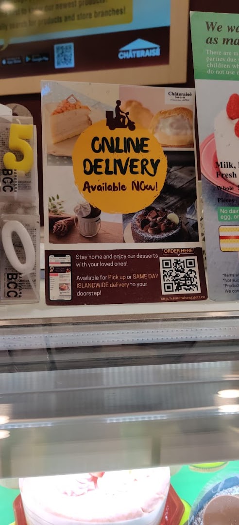 A Châteraisé display promoting online delivery and islandwide pickup for their delicious desserts.