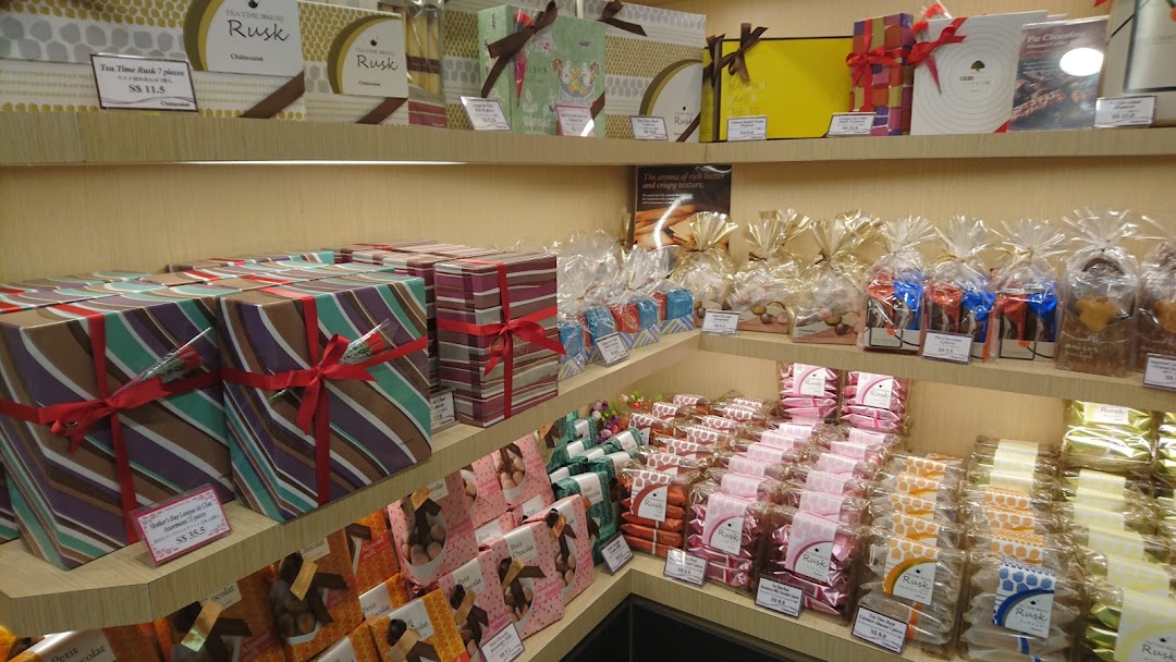 Shelves filled with beautifully packaged Japanese sweets, chocolates, and baked goods at Châteraisé.